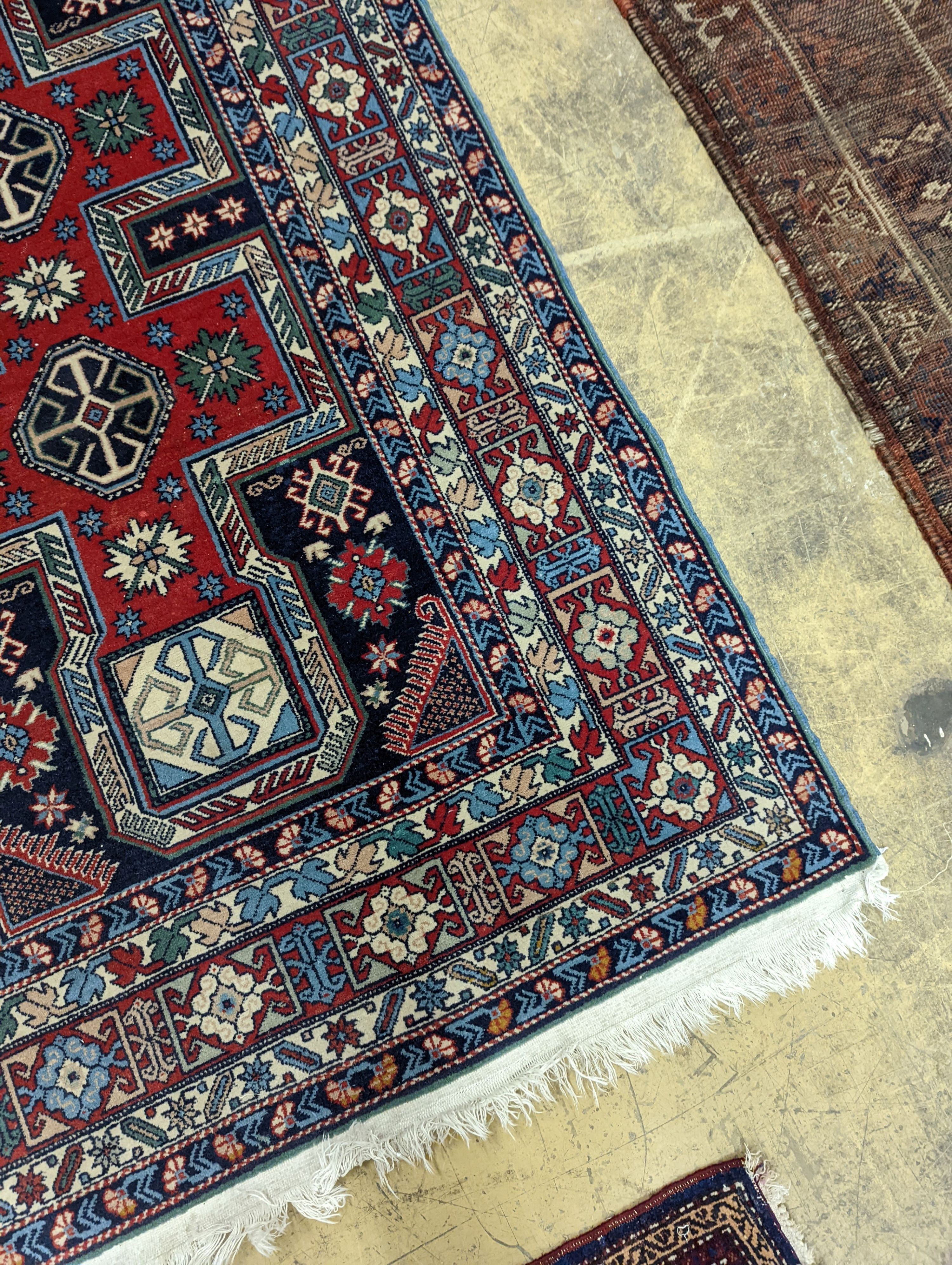 A Caucasian blue ground rug, 166 x 100cm